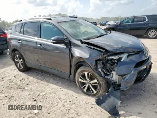 2018 Toyota RAV4 XLE with VIN 2T3WFREV2JW409292, listed as a Copart auction lot 61577355 with 189,258 mi miles and Salvage title. Bid and sale history available at DreamBid. Image 4.