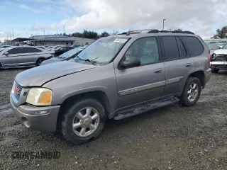 2005 GMC Envoy SLT with VIN 1GKDS13S852320018, listed as a Copart auction lot 80496544 with 237,451 mi miles and Salvage Title. Bid and sale history available at carsss.com. Image 1.