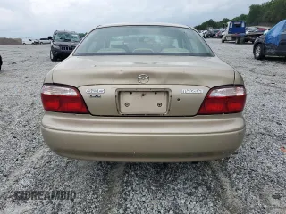 2001 Mazda 626 LX z VIN 1YVGF22C715202574, wystawiony jako Copart lot #54132915 z przebiegiem 237 041 mil mil oraz Szkody całkowita. Historia ofert i sprzedaży dostępna na DreamBid. Obrazek 6.