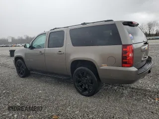 2013 Chevrolet Suburban LT with VIN 1GNSKJE77DR131188, listed as a Copart auction lot 52880375 with 147,278 mi miles and Salvage Title. Bid and sale history available at DreamBid. Image 2.
