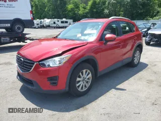 2016 Mazda CX-5 Sport with VIN JM3KE4BY3G0765905, listed as a Copart auction lot 61874165 with 134,546 mi miles and Salvage title. Bid and sale history available at DreamBid. Image 1.