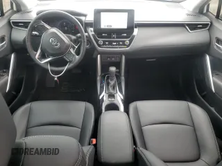 2023 Toyota Corolla Cross XLE with VIN 7MUDAABG3PV044005, listed as a Copart auction lot 54955225 with 50,712 mi miles and Salvage title. Bid and sale history available at DreamBid. Image 8.
