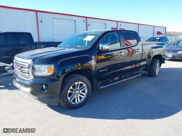 2015 GMC Canyon 4WD SLT with VIN 1GTG6CE33F1134747, listed as a IAAI auction lot 41502300 with 143,027 mi miles. Bid and sale history available at carsss.com. Image 2.