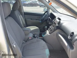 2007 Kia Rondo LX with VIN KNAFG525777087180, listed as a IAAI auction lot 42094657 with 125,256 mi miles. Bid and sale history available at carsss.com. Image 5.
