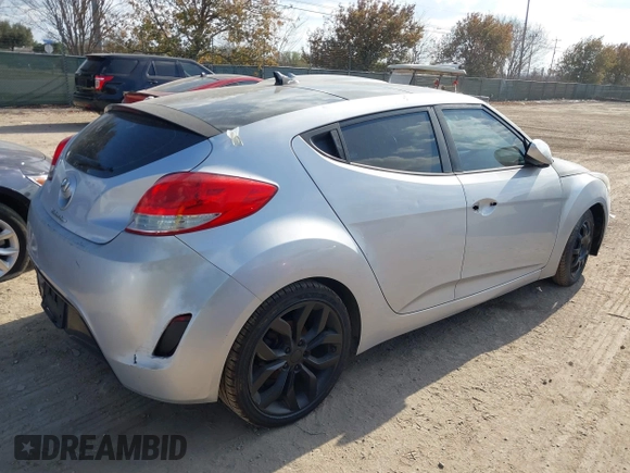 2012 Hyundai Veloster w/Gray Int with VIN KMHTC6AD0CU068400, listed as a IAAI auction lot 41493521 with 72,682 mi miles and . Bid and sale history available at DreamBid. Image 4.