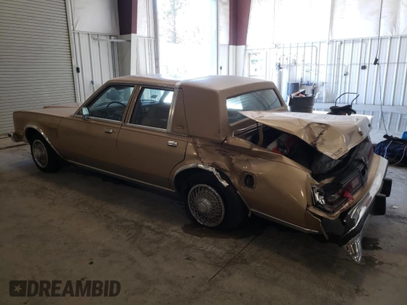 1983 Chrysler New Yorker 5th Ave Edition z VIN 2C3BF66P5DR150653, wystawiony jako Copart lot #75411924 z przebiegiem 67 095 mil mil oraz Szkody całkowita. Historia ofert i sprzedaży dostępna na DreamBid. Obrazek 2.