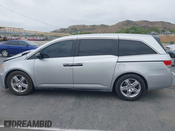 2014 Honda Odyssey LX z VIN 5FNRL5H28EB064426, wystawiony jako IAAI lot #42207634 z przebiegiem 169 706 mil mil oraz . Historia ofert i sprzedaży dostępna na DreamBid. Obrazek 14.