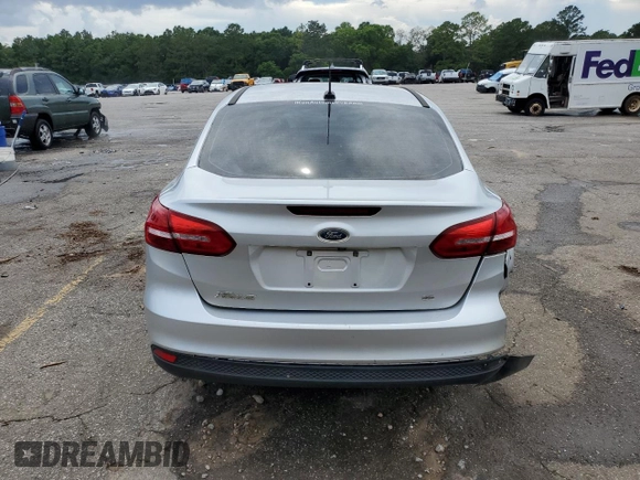 2017 Ford Focus SE with VIN 1FADP3F29HL242325, listed as a Copart auction lot 61153555 with 136,666 mi miles and Salvage title. Bid and sale history available at DreamBid. Image 6.