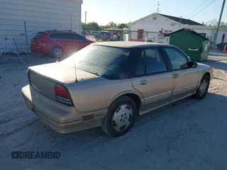 1997 Oldsmobile Cutlass Supreme S z VIN 1G3WH52MXVF314579, wystawiony jako IAAI lot #41755336 z przebiegiem 145 916 mil mil oraz . Historia ofert i sprzedaży dostępna na DreamBid. Obrazek 4.