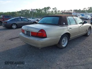 1999 Mercury Grand Marquis LS z VIN 2MEFM75W1XX703878, wystawiony jako IAAI lot #42074187 z przebiegiem 56 962 mil mil oraz . Historia ofert i sprzedaży dostępna na DreamBid. Obrazek 4.