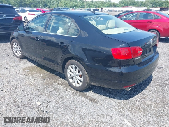 2014 Volkswagen Jetta SE with VIN 3VWD17AJ4EM429576, listed as a IAAI auction lot 42542604 with 142,313 mi miles and . Bid and sale history available at DreamBid. Image 3.