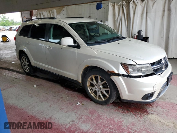 2013 Dodge Journey SXT with VIN 3C4PDDBG1DT521452, listed as a Copart auction lot 62660785 with 177,945 mi miles and Salvage title. Bid and sale history available at DreamBid. Image 4.