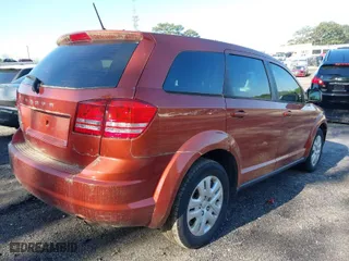 2014 Dodge Journey SE with VIN 3C4PDCAB9ET245801, listed as a IAAI auction lot 41982250 with 119,468 mi miles. Bid and sale history available at carsss.com. Image 4.