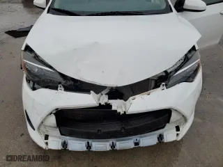 2019 Toyota Corolla L with VIN 5YFBURHE6KP884410, listed as a Copart auction lot 86710474 with 105,265 mi miles and Salvage Title. Bid and sale history available at carsss.com. Image 12.
