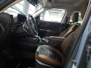 2023 Ford Bronco Sport Badlands z VIN 3FMCR9D91PRE01918, wystawiony jako Copart lot #52120145 z przebiegiem 8 415 mil mil oraz Szkoda całkowita • Salvage title. Historia ofert i sprzedaży dostępna na DreamBid. Obrazek 7.