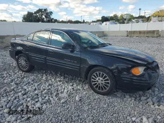 1999 Pontiac Grand Am SE2 with VIN 1G2NE52E2XM732523, listed as a Copart auction lot 75420684 with 124,110 mi miles and Salvage title. Bid and sale history available at DreamBid. Image 4.