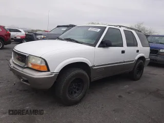 1999 GMC Jimmy SLE with VIN 1GKDT13W1X2551085, listed as a Copart auction lot 50553055 with 189,974 mi miles and Salvage Title. Bid and sale history available at carsss.com. Image 1.