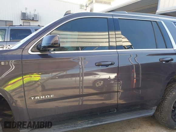 2015 Chevrolet Tahoe LS with VIN 1GNSCAKCXFR628303, listed as a IAAI auction lot 42002698 with 152,141 mi miles and . Bid and sale history available at DreamBid. Image 14.