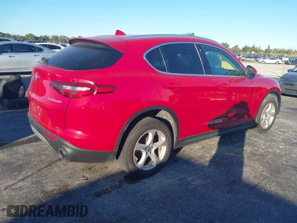 2018 Alfa Romeo Stelvio z VIN ZASFAKAN3J7C20066, wystawiony jako IAAI lot #40879859 z przebiegiem 50 131 mil mil oraz . Historia ofert i sprzedaży dostępna na DreamBid. Obrazek 4.