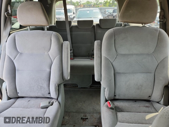 2007 Honda Odyssey LX z VIN 5FNRL38257B011710, wystawiony jako Copart lot #61163265 z przebiegiem 196 575 mil mil oraz Czysty tytuł • Clean title. Historia ofert i sprzedaży dostępna na DreamBid. Obrazek 10.