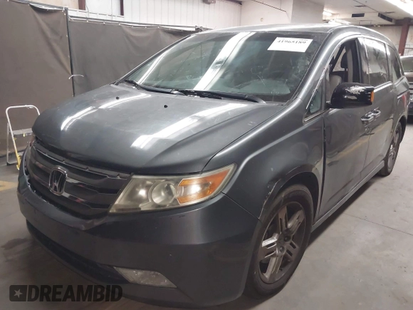 2012 Honda Odyssey Touring с VIN 5FNRL5H99CB047340, выставлен на аукционе IAAI как лот 41965189 с пробегом Не указан миль и . История ставок и продаж доступна на DreamBid. Изображение 2.