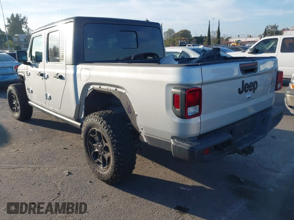 2022 Jeep Gladiator Willys with VIN 1C6HJTAG4NL132558, listed as a IAAI auction lot 41626851 with 28,251 mi miles and . Bid and sale history available at DreamBid. Image 3.