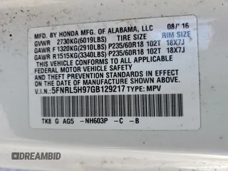 2016 Honda Odyssey Touring Elite with VIN 5FNRL5H97GB129217, listed as a Copart auction lot 52177765 with 138,045 mi miles and Salvage Title. Bid and sale history available at DreamBid. Image 13.