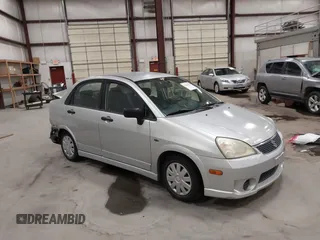 2006 Suzuki Aerio Premium z VIN JS2RA62S965303186, wystawiony jako IAAI lot #42043430 z przebiegiem 103 116 mil mil oraz . Historia ofert i sprzedaży dostępna na DreamBid. Obrazek 1.