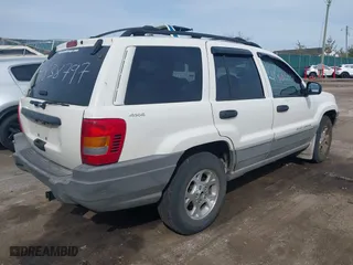 1999 Jeep Grand Cherokee Laredo with VIN 1J4GW58SXXC623404, listed as a IAAI auction lot 41838797 with 0 mi miles. Bid and sale history available at carsss.com. Image 4.