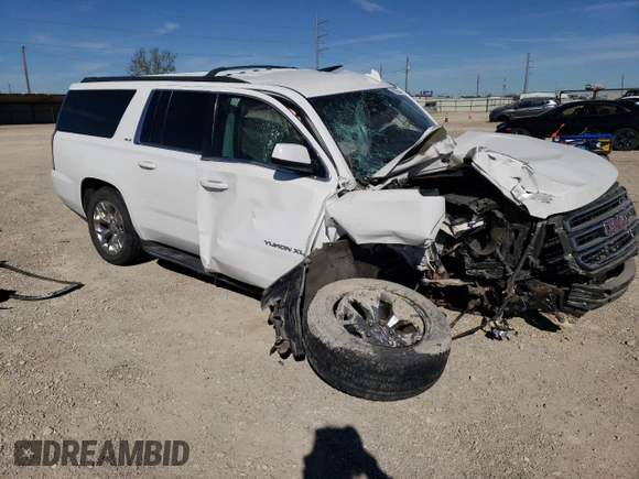 2015 GMC Yukon XL SLE z VIN 1GKS1GKC1FR643293, wystawiony jako Copart lot #82106544 z przebiegiem 164 623 mil mil oraz Szkoda całkowita • Salvage title. Historia ofert i sprzedaży dostępna na DreamBid. Obrazek 4.