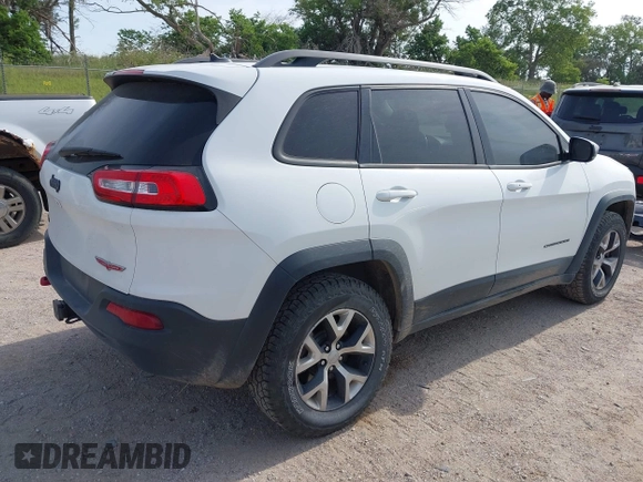 2015 Jeep Cherokee Trailhawk with VIN 1C4PJMBS6FW687718, listed as a IAAI auction lot 42505169 with 122,526 mi miles and . Bid and sale history available at DreamBid. Image 4.