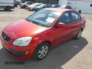 2009 Kia Rio SX with VIN KNADE223396484470, listed as a IAAI auction lot 41964027 with 167,380 mi miles. Bid and sale history available at carsss.com. Image 2.