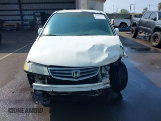 2002 Honda Odyssey EX z VIN 2HKRL18632H556791, wystawiony jako IAAI lot #41562553 z przebiegiem 222 976 mil mil oraz . Historia ofert i sprzedaży dostępna na DreamBid. Obrazek 13.
