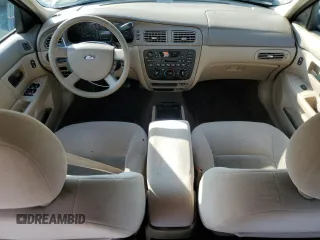 2005 Ford Taurus SE with VIN 1FAFP53U95A101336, listed as a Copart auction lot 56457095 with 127,656 mi miles and Salvage title. Bid and sale history available at DreamBid. Image 8.