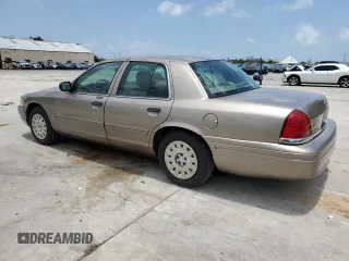 2005 Ford Crown Victoria Standard с VIN 2FAFP73WX5X144927, выставлен на аукционе Copart как лот 59713204 с пробегом 160 270 миль миль и Списание • Salvage title. История ставок и продаж доступна на DreamBid. Изображение 2.