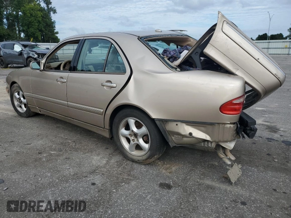 2001 Mercedes-Benz E-Class with VIN WDBJF70JX1B194075, listed as a Copart auction lot 70482944 with 218,319 mi miles and Salvage Title. Bid and sale history available at carsss.com. Image 2.