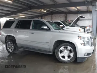 2015 Chevrolet Tahoe LTZ with VIN 1GNSCCKC5FR123099, listed as a IAAI auction lot 41391974 with Not provided miles and . Bid and sale history available at DreamBid. Image 13.