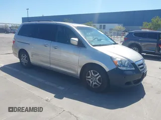 2006 Honda Odyssey EX-L with VIN 5FNRL38766B038599, listed as a IAAI auction lot 41989217 with 164,118 mi miles. Bid and sale history available at carsss.com. Image 1.