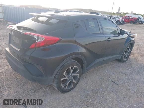 2018 Toyota C-HR XLE with VIN JTNKHMBX6J1007058, listed as a IAAI auction lot 42100587 with 71,725 mi miles and . Bid and sale history available at DreamBid. Image 4.