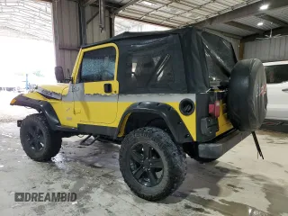2002 Jeep Wrangler Sport z VIN 1J4FA49S02P730417, wystawiony jako Copart lot #59620865 z przebiegiem Nie podano mil oraz Szkoda całkowita • Salvage title. Historia ofert i sprzedaży dostępna na DreamBid. Obrazek 2.