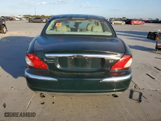 2004 Jaguar X-Type with VIN SAJEA51C24WE14915, listed as a Copart auction lot 77828734 with 0 mi miles and Salvage Title. Bid and sale history available at carsss.com. Image 6.
