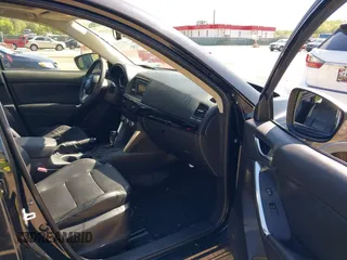 2013 Mazda CX-5 Grand Touring with VIN JM3KE4DE6D0127601, listed as a IAAI auction lot 42143558 with 95,719 mi miles and . Bid and sale history available at DreamBid. Image 5.