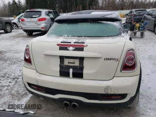 2013 MINI Coupe S z VIN WMWSX3C56DT772517, wystawiony jako Copart lot #83702084 z przebiegiem 106 910 mil mil oraz Tytuł czysty. Historia ofert i sprzedaży dostępna na DreamBid. Obrazek 6.