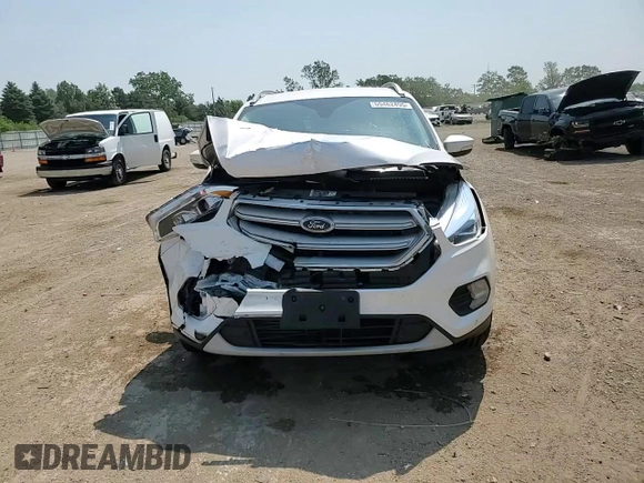 2019 Ford Escape Titanium z VIN 1FMCU9J93KUA51020, wystawiony jako Copart lot #60462495 z przebiegiem 59 998 mil mil oraz Szkoda całkowita • Salvage title. Historia ofert i sprzedaży dostępna na DreamBid. Obrazek 13.