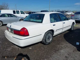 2002 Mercury Grand Marquis GS with VIN 2MEFM74W02X662931, listed as a IAAI auction lot 41806481 with 133,669 mi miles. Bid and sale history available at carsss.com. Image 4.