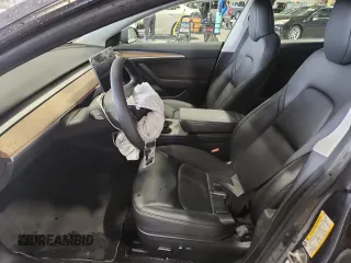 2023 Tesla Model 3 with VIN 5YJ3E1EA4PF554840, listed as a Copart auction lot 63731175 with Not provided miles and Salvage title. Bid and sale history available at DreamBid. Image 7.