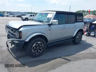 2023 Ford Bronco z VIN 1FMEE5DPXPLB06603, wystawiony jako IAAI lot #42183408 z przebiegiem 22 272 mil mil oraz . Historia ofert i sprzedaży dostępna na DreamBid. Obrazek 2.