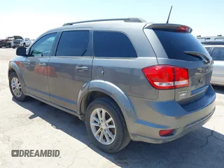 2013 Dodge Journey SXT with VIN 3C4PDCBB4DT563709, listed as a IAAI auction lot 42019033 with 201,188 mi miles. Bid and sale history available at carsss.com. Image 3.