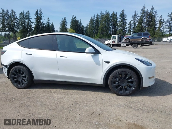 2023 Tesla Model Y Long Range with VIN 7SAYGDEE4PF676167, listed as a IAAI auction lot 42147909 with 20,488 mi miles. Bid and sale history available at carsss.com. Image 14.