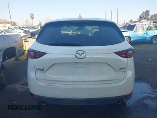 2017 Mazda CX-5 Grand Touring with VIN JM3KFBDL6H0164993, listed as a IAAI auction lot 41450556 with 97,733 mi miles. Bid and sale history available at carsss.com. Image 16.